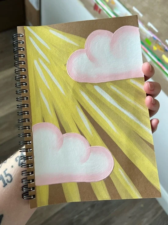 Hand-Painted Blank Spiral Notebook with Pink Clouds and Yellow Sun Rays