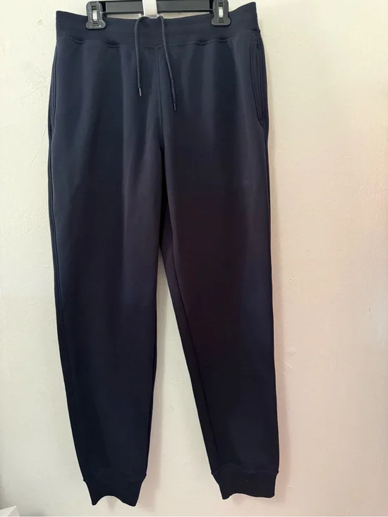Navy blue UNIQLO Heattech pile lined sweatpants in size L. NWT