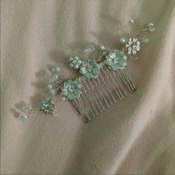Silver beaded hair piece.