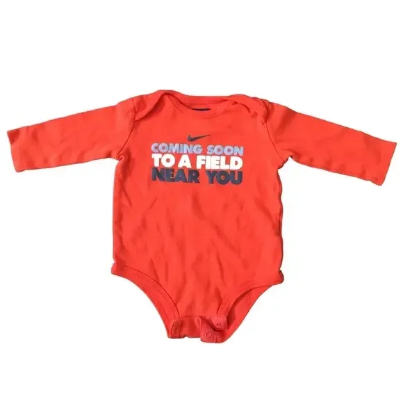 EUC Nike‎ orange onesie size 3-6M