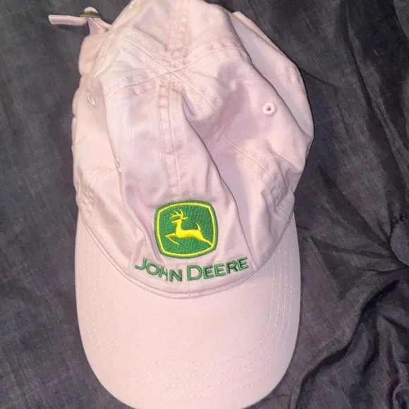 Pink John Deere hat with adjustable strap.