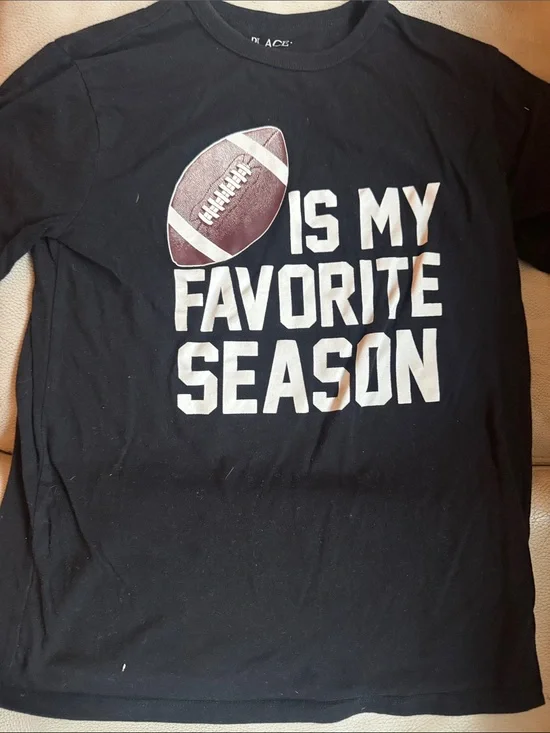 The Children's Place Black Tee with White Text and Brown Football Graphic