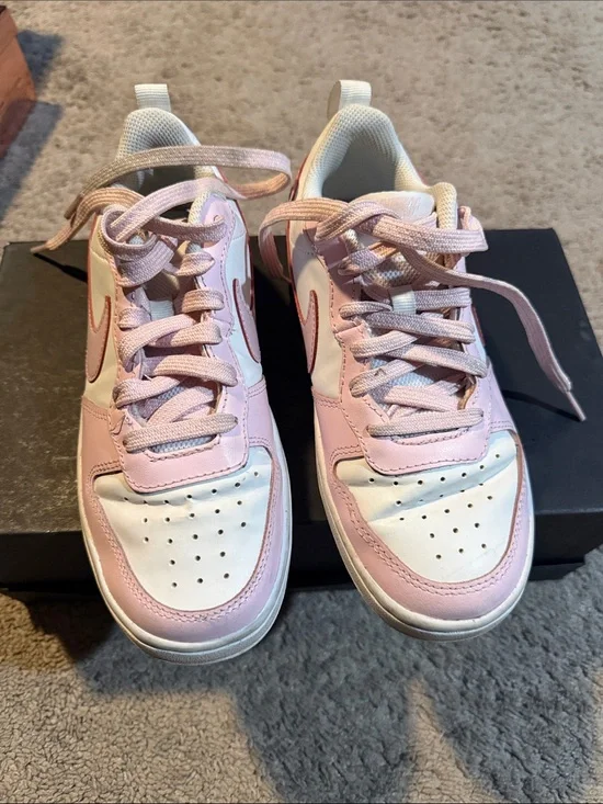 Nike pink and white low top sneakers