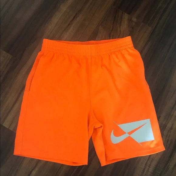 Nike boys Bright Orange Athletic Shorts with Reflective Logo