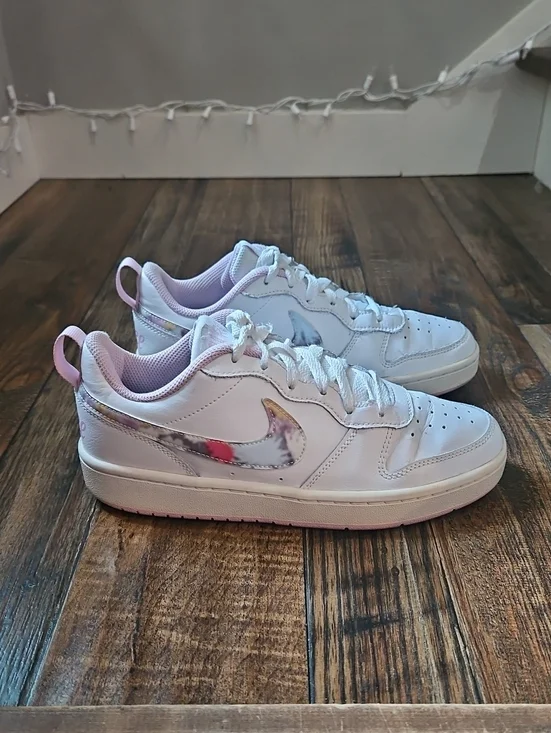 Nike White Low-Top Sneakers with Marbled Swoosh and Pink Details