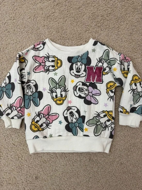 Kids White Daisy Duck Print Sweatshirt with Pink 'M' Patch