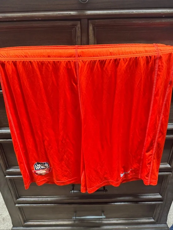 Player issued bowl game. Nike Bright Orange Performance Shorts.