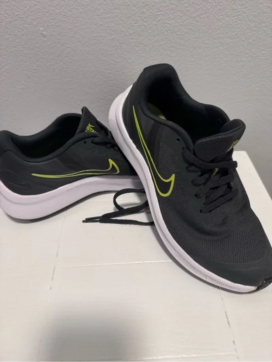 Nike Black Sneakers with Neon Yellow Swoosh and White Sole