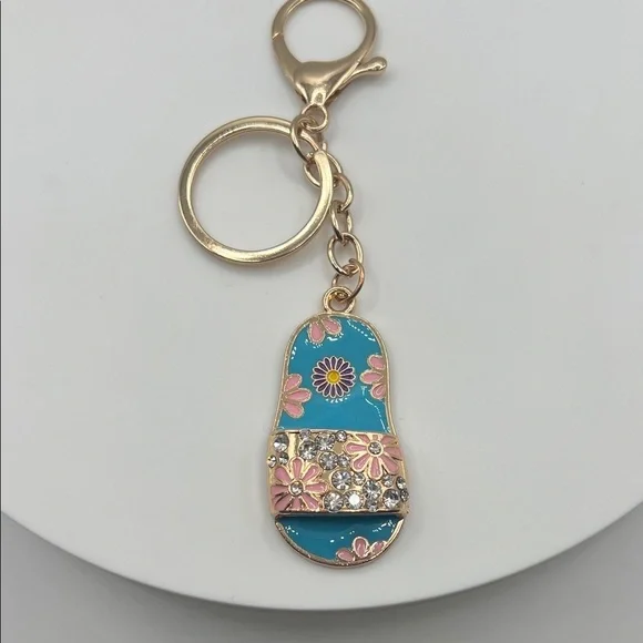 566. Gold and Blue Floral Sandal Keychain
