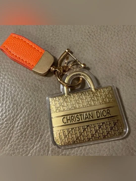 Designer inspired Gold colored  Logo Bag Charm Keychain with Orange Strap