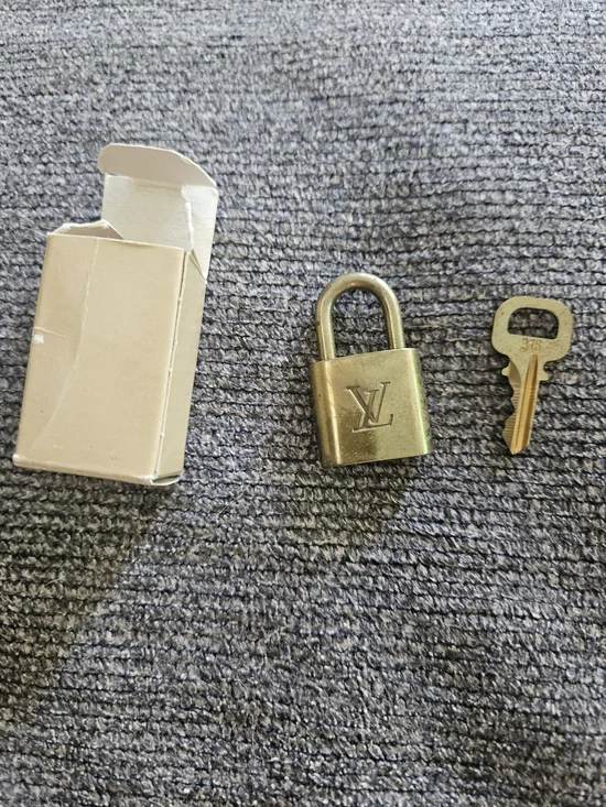 Louis Vuitton Gold Padlock and Key Set