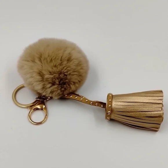 Keychain Accessory Tan Metallic with Puff & tassel Never used