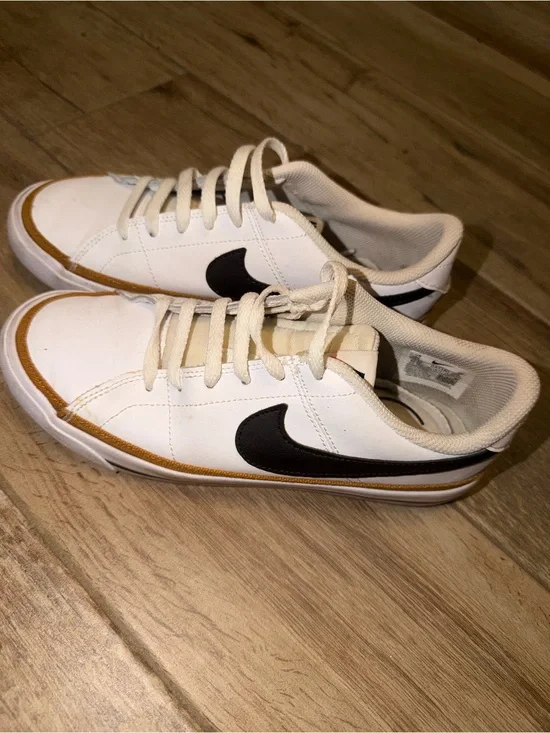 Nike White Low-Top Sneakers with Black Swoosh and Tan Trim