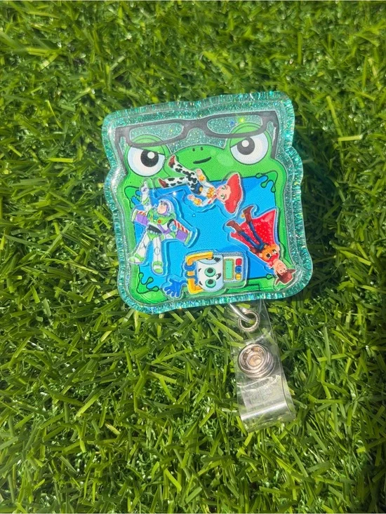 Green Frog Badge Reel with Colorful Toy Story Decals