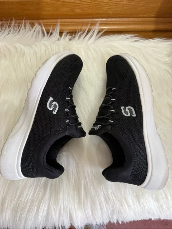 Skechers Women's Black Knit Slip-On Athletic Sneakers with White Sole