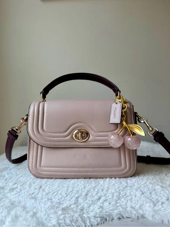 Coach Marlie Top Handle bag  Quilted Leather in pink with charm