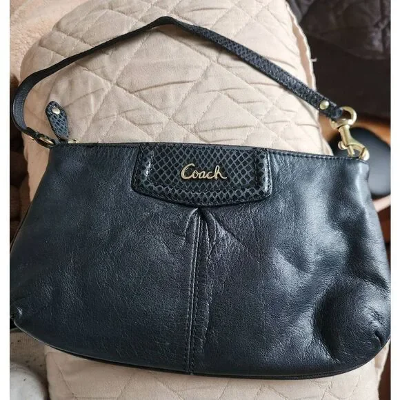 Coach Ashley large black leather wristlet. Approx 9.5 wide, 5.5 high
