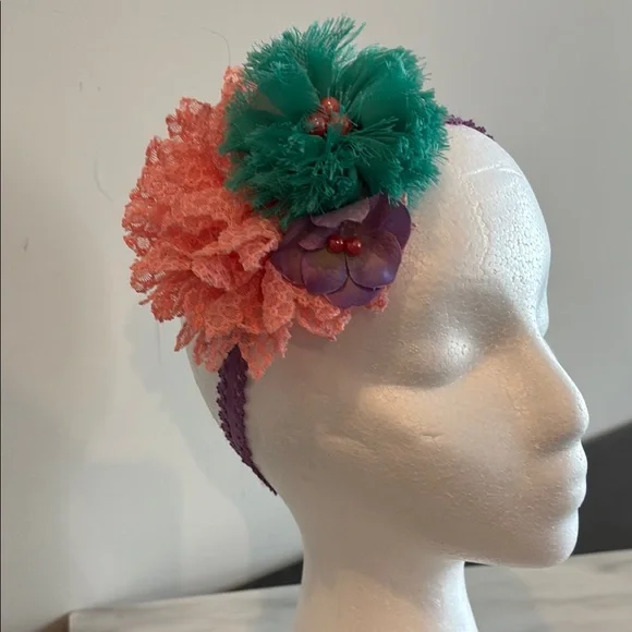 Green and Pink Floral Hair Accessory with Pom-Pom Design