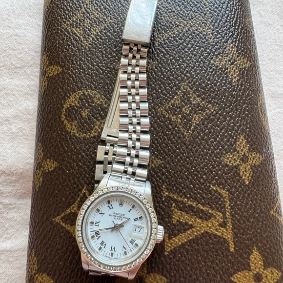 Rolex Silver Watch with White Dial and Diamond Bezel
