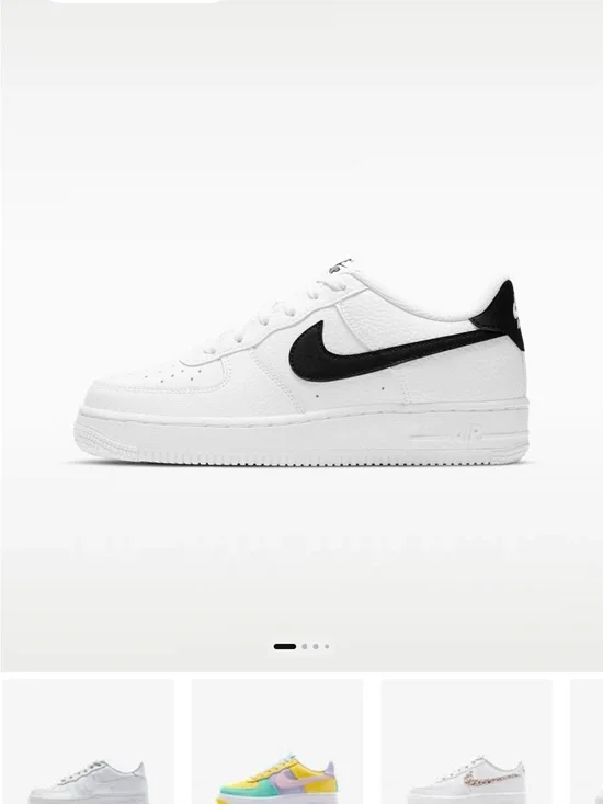 Nike White Low-Top Sneakers with Black Swoosh