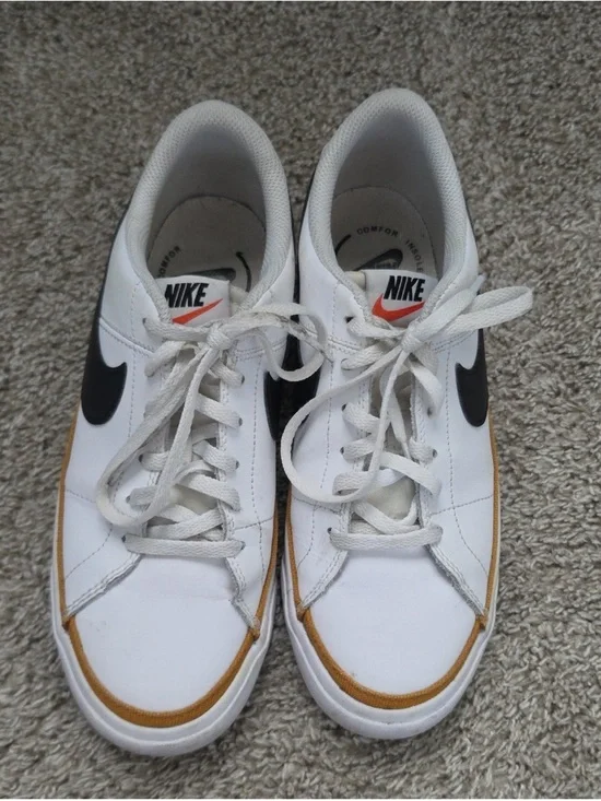 Nike White Sneakers with Black Swoosh and Tan Accent
