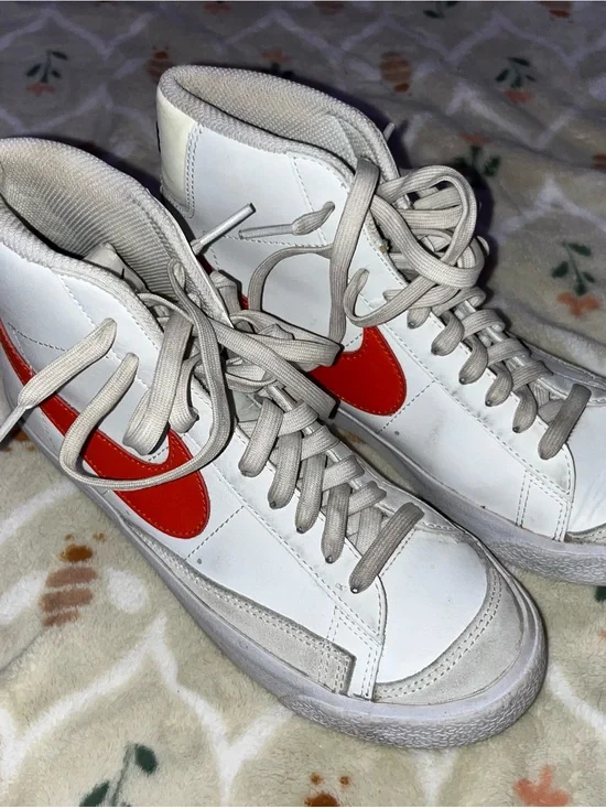 Nike White High-Top Sneakers with Red Swoosh