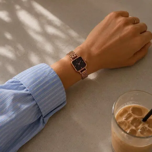 Rose gold watch with black accents