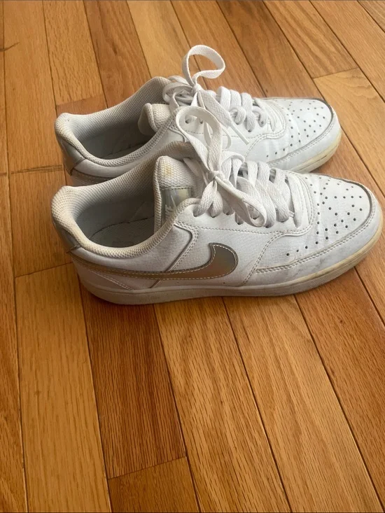Nike White Low-Top Sneakers with Silver Swoosh Accent