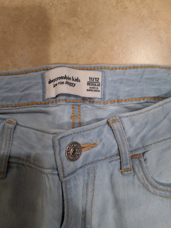 abercrombie kids light blue skinny jeans with tan stitching
