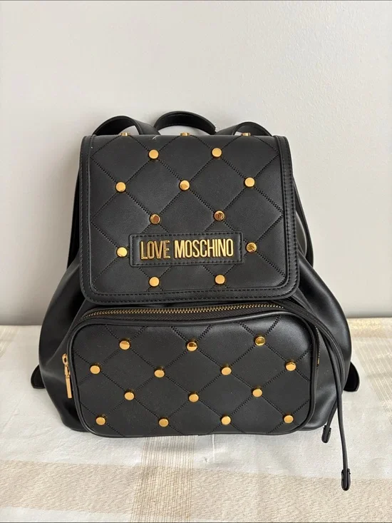 BNWOT Designer LOVE MOSCHINO Backpack, Faux Leather, with gold metal design.
