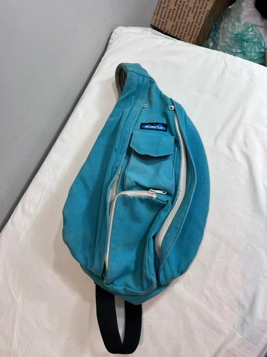 Kavu teal rope sling bag backpack