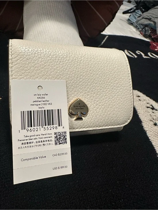 kate spade cream pebbled leather small zip wallet with gold spade emblem