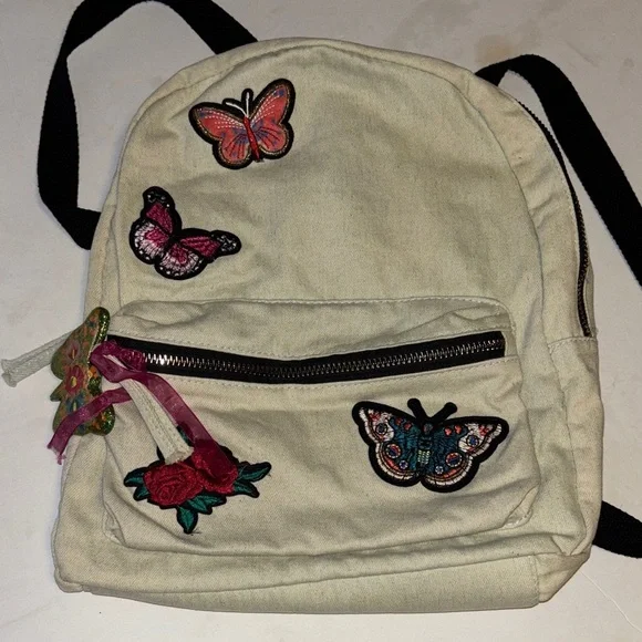 ATMOSPHERE BRAND OFF WHITE DENIM BACKPACK WITH BUTTERFLY PATCH DESIGN   PRELOVED