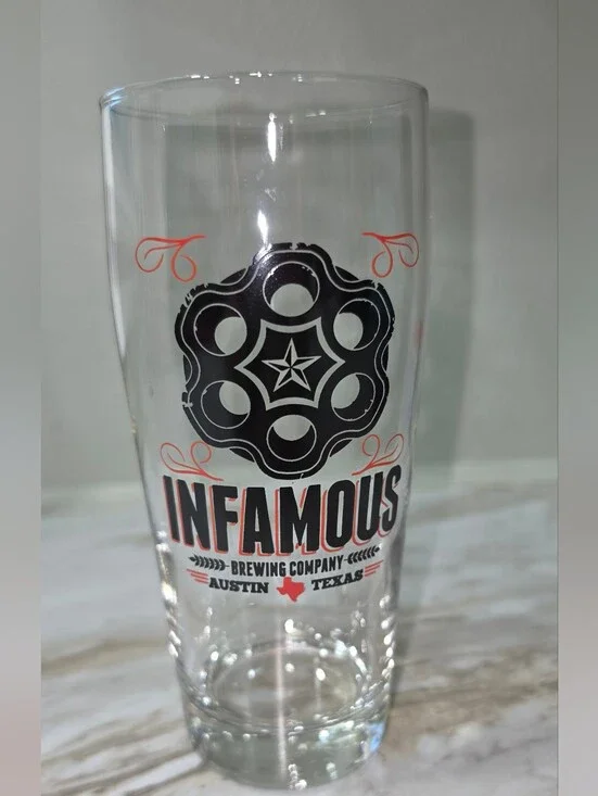 Infamous Brewing Company Tall Glass - Black & Orange Logo