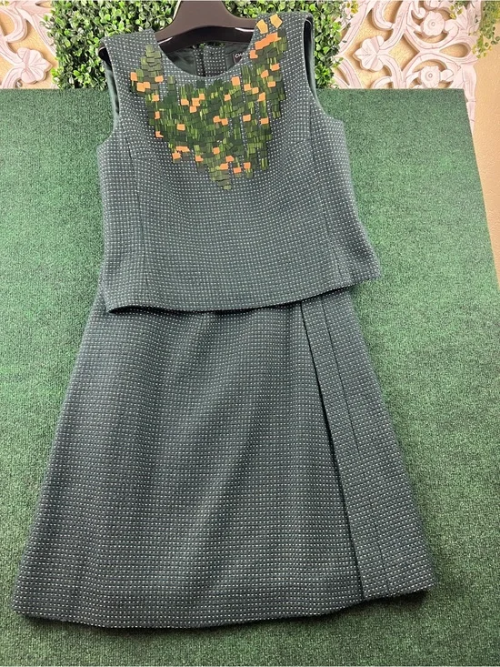 Classic Green Two-Piece Sleeveless Dress with Embellished Neckline