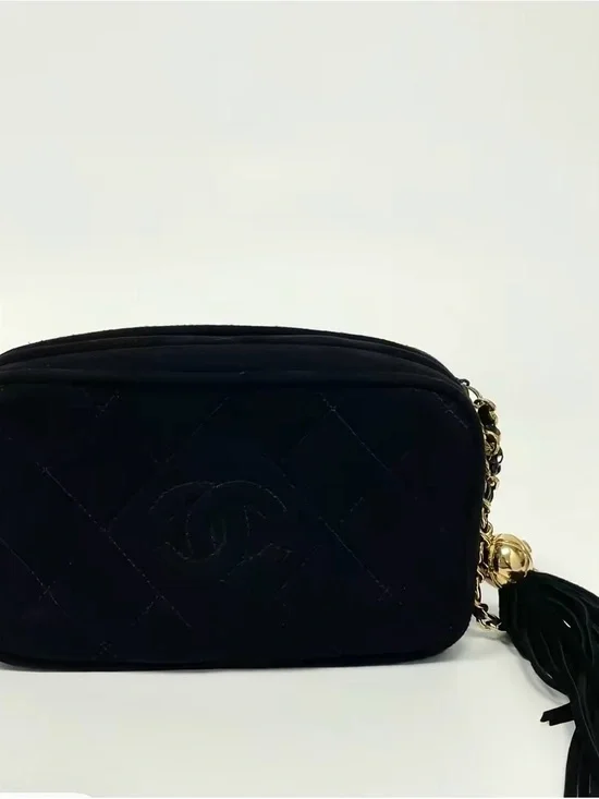 CHANEL Black Quilted Crossbody Bag with Gold Chain and Tassel