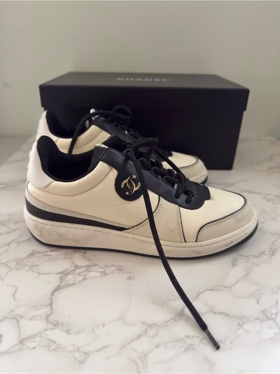 CHANEL Leather Cream and Black CC Charm Low-Top Sneakers