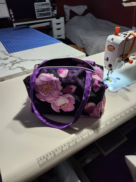 Purple Floral Cosmetic Bag with Black Background
