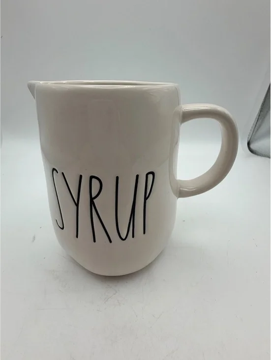 Rae Dunn white ceramic syrup pitcher.with handle. In like new condition