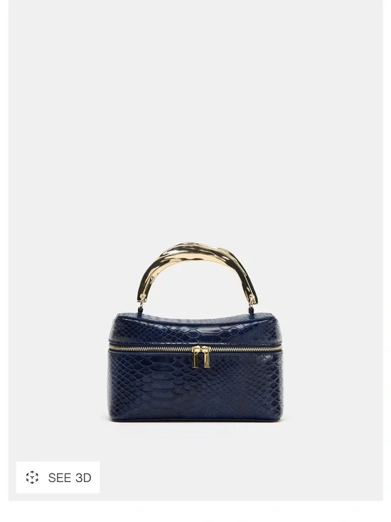 EMBOSSED VANITY BAG