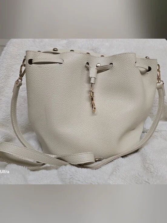 Cream Pebbled Leather Drawstring Shoulder Bucket Bag with Gold Accents