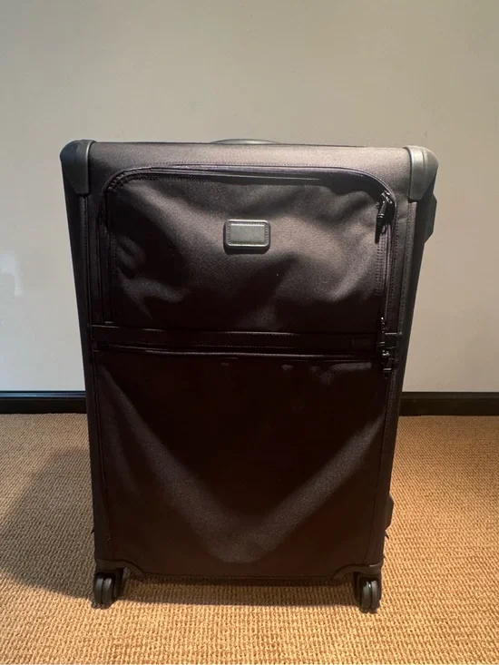 Tumi Black Softside Spinner check luggage with Front Pocket