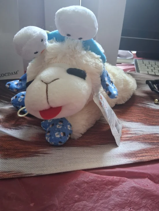 Plush Lamb Toy with Blue Accents and Smiling Face