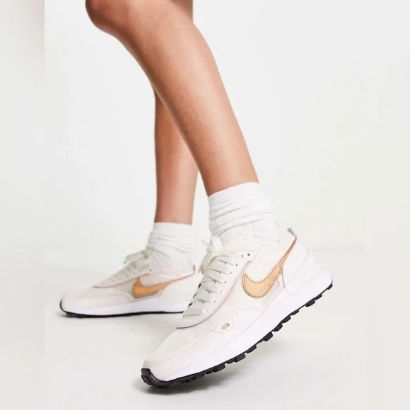 Nike Women's Sneakers in White with Metallic Rose Gold Swoosh