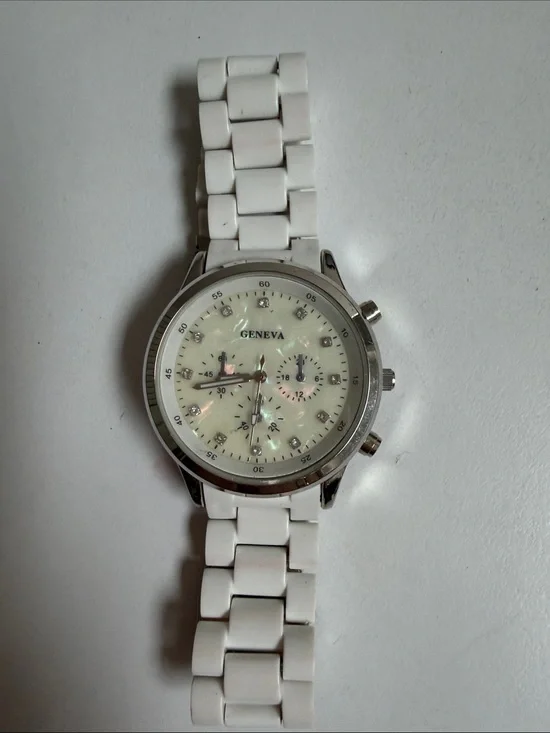 Geneva White Ceramic-Link Watch with Iridescent Dial Accents needs battery
