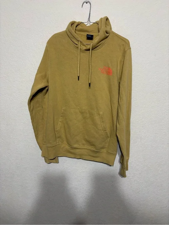 The North Face Mustard Pullover Hoodie with mountain outdoors scenery