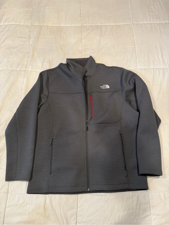 The North Face Men's Dark Gray Lightweight Jacket with Red Zip Accent