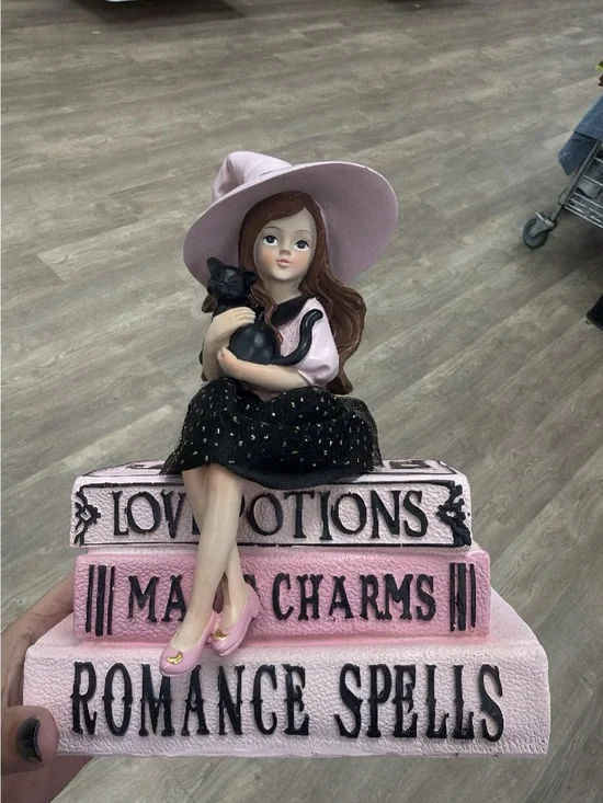 Halloween witch on spell books