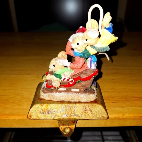 An unbranded Mouse and sleigh stocking holder. The base is 3.75