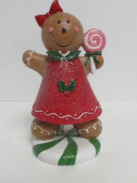 Festive Gingerbread Girl Figurine Holding Pink Lollipop